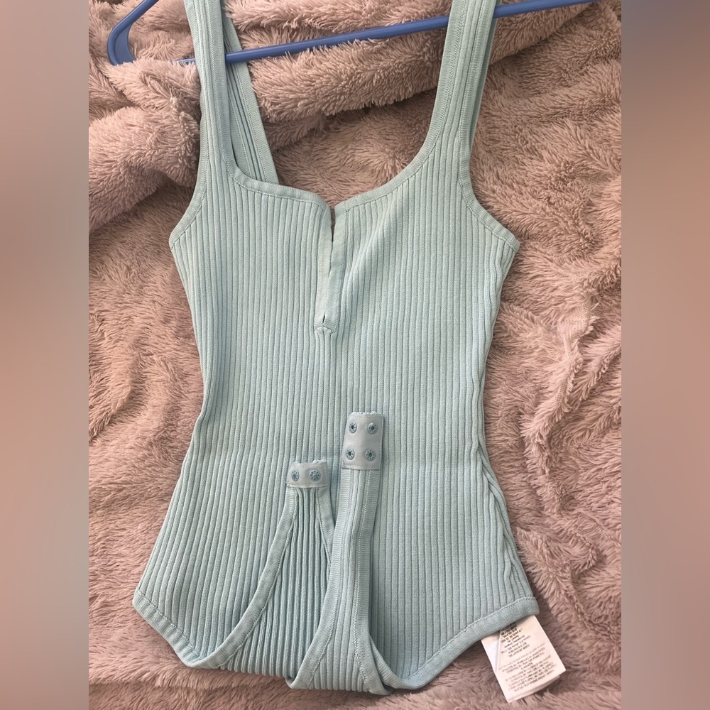 Guess light blue bodysuit , small size , fabric is super stretchy